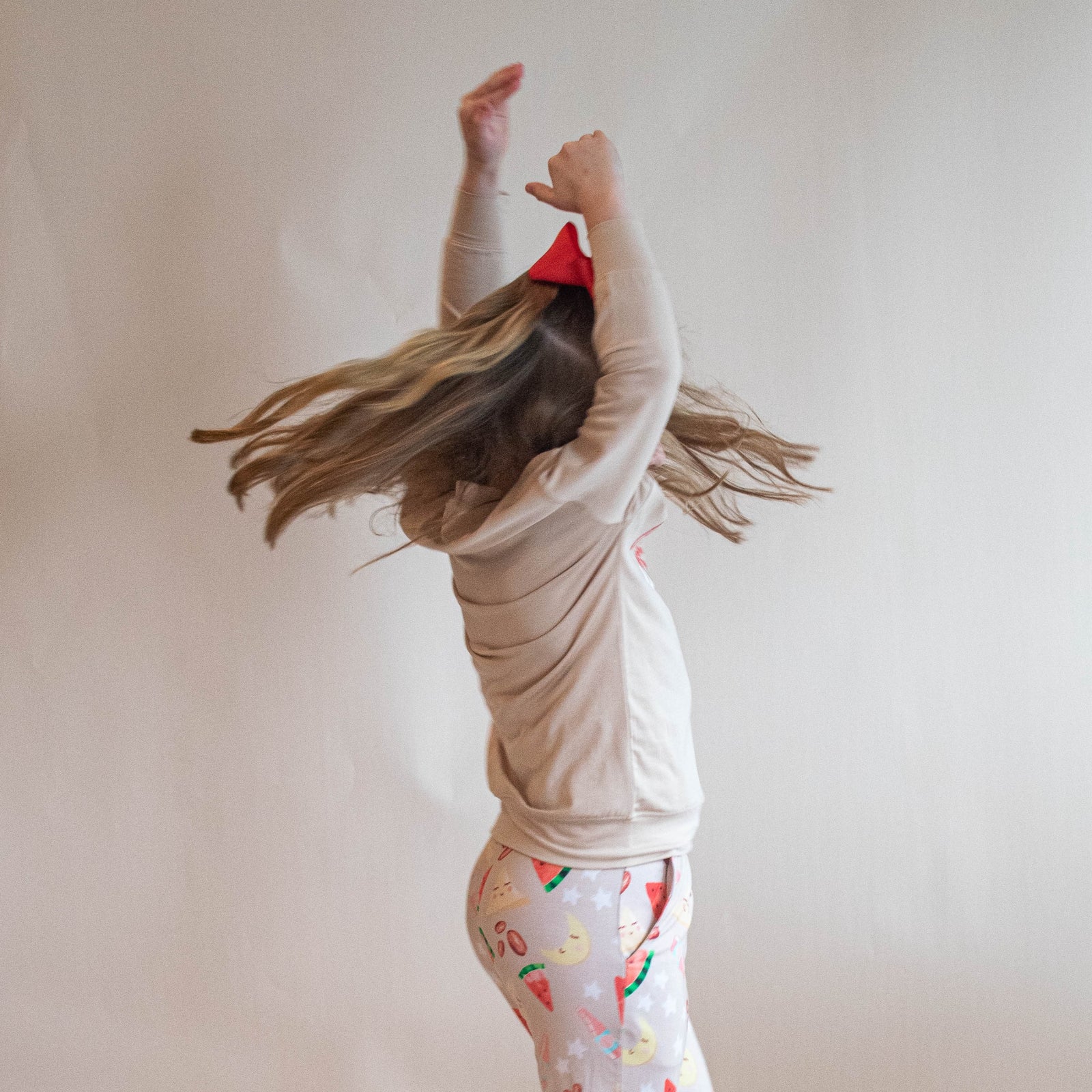 Boy wearing jogger set with "is it iftar yet" on his shirt and pants.  hands in pockets